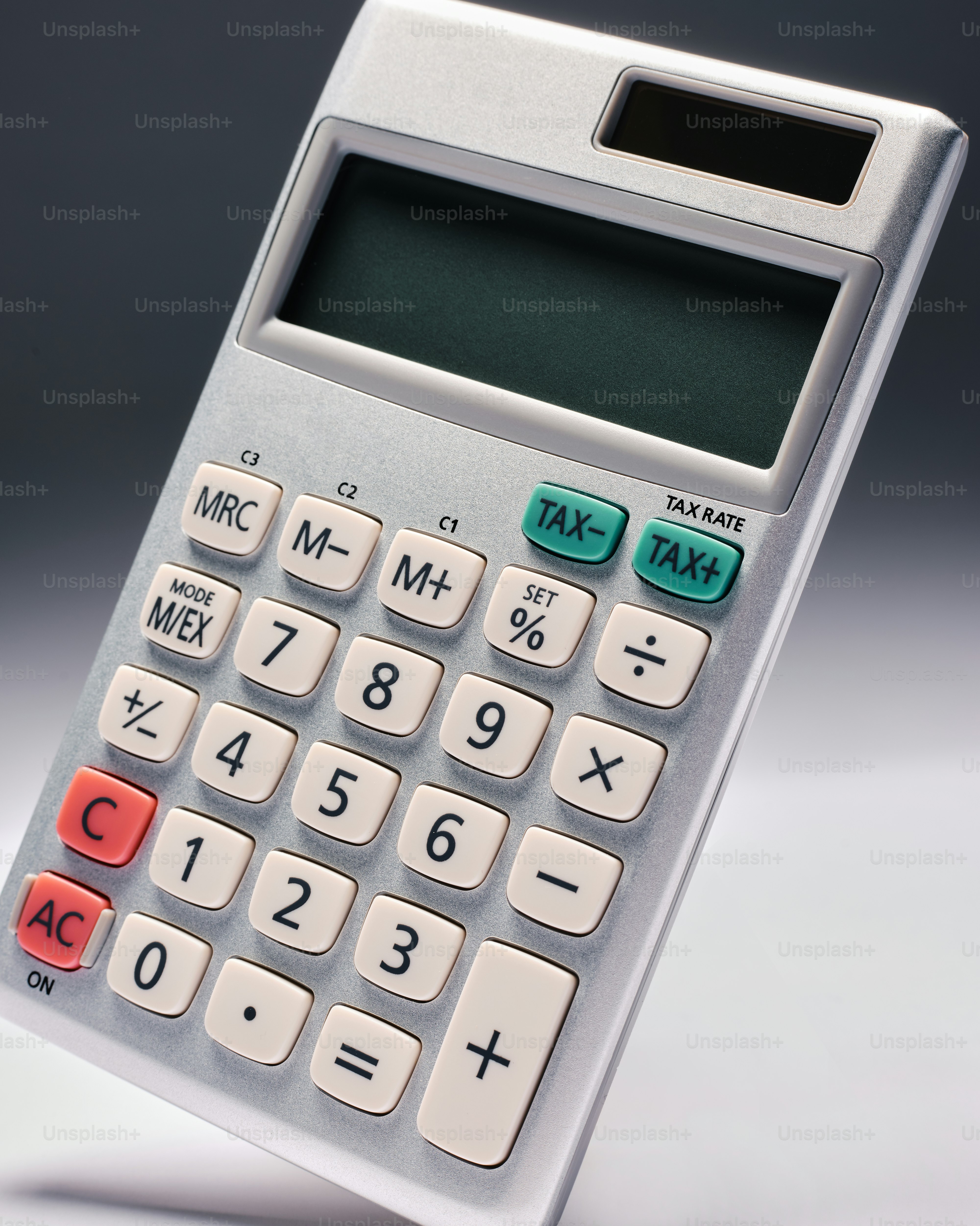 a close up of a calculator on a table